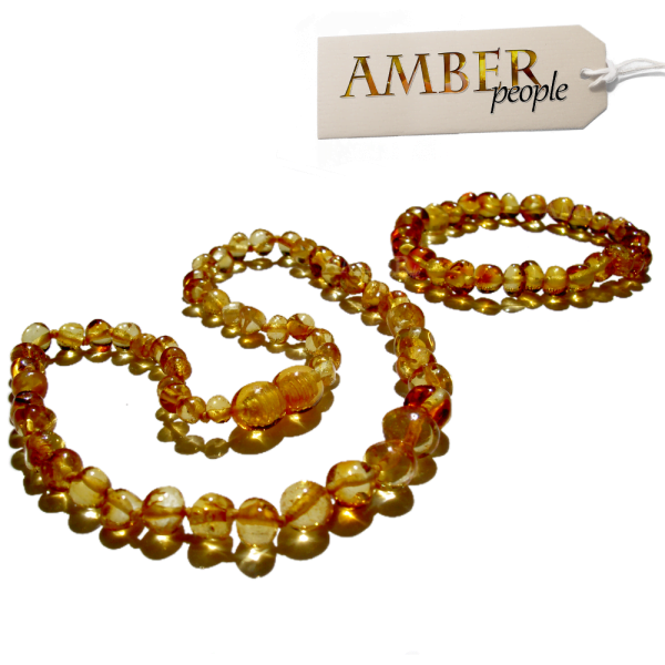 Baltic amber baby child teething necklace and bracelet set in golden honey displayed in the main product image