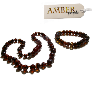 Baltic amber baby child teething necklace and bracelet set in cherry displayed in the main product image